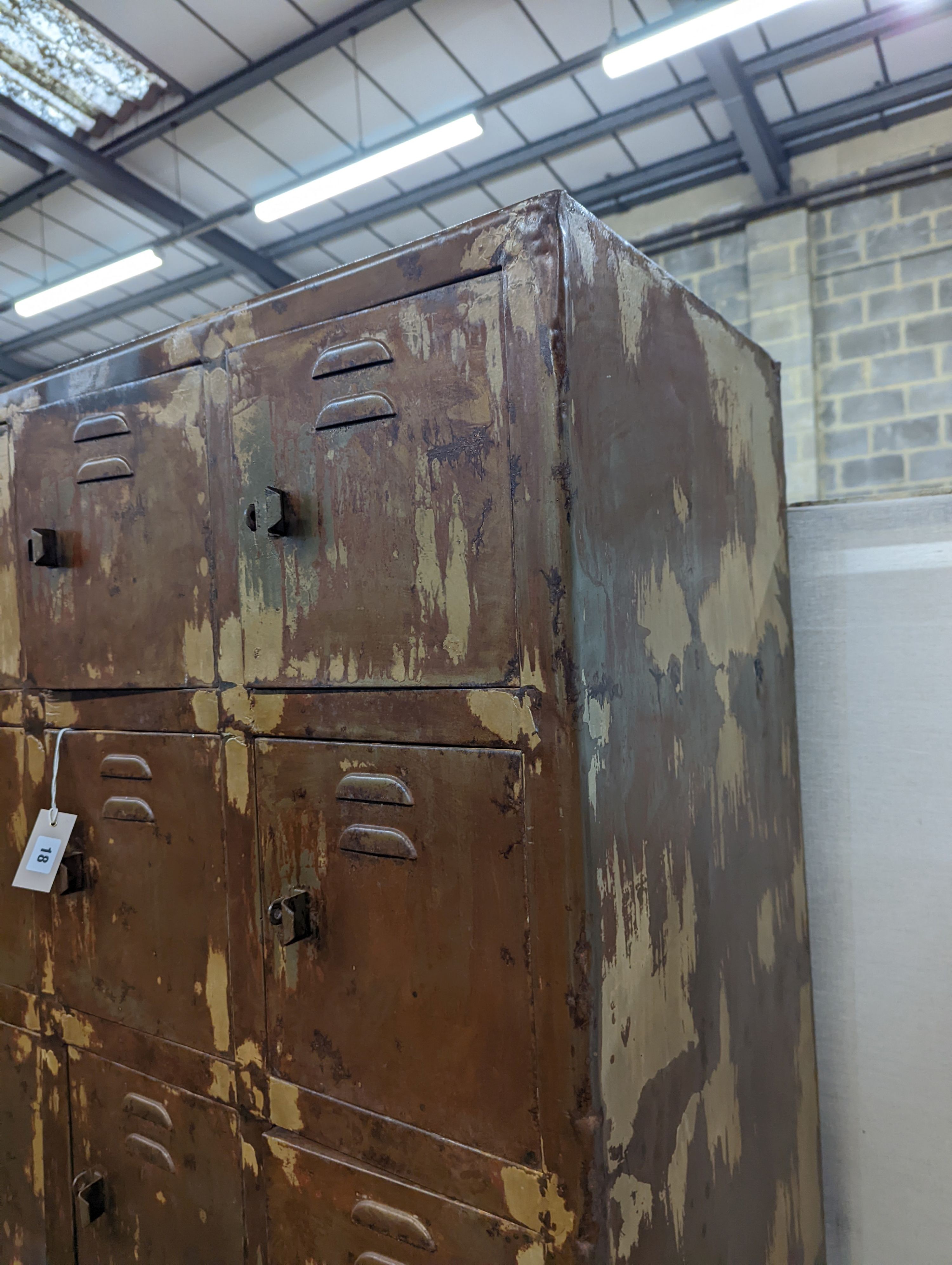 An industrial style metal locker unit. W-91cm, D-49cm, H-198cm.